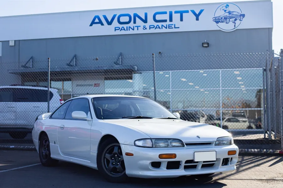 Finished Silvia at the Avon City Paint & Panel building, front three-quarter